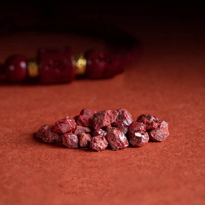 Raw cinnabar mineral ore chunks and finished Tibetan Om Mani Padme Hum blessing bracelet - sourcing and craftsmanship comparison