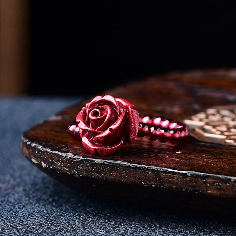 Cinnabar rose charm adjustable ring with blooming flower design and protective energy for daily spiritual practice