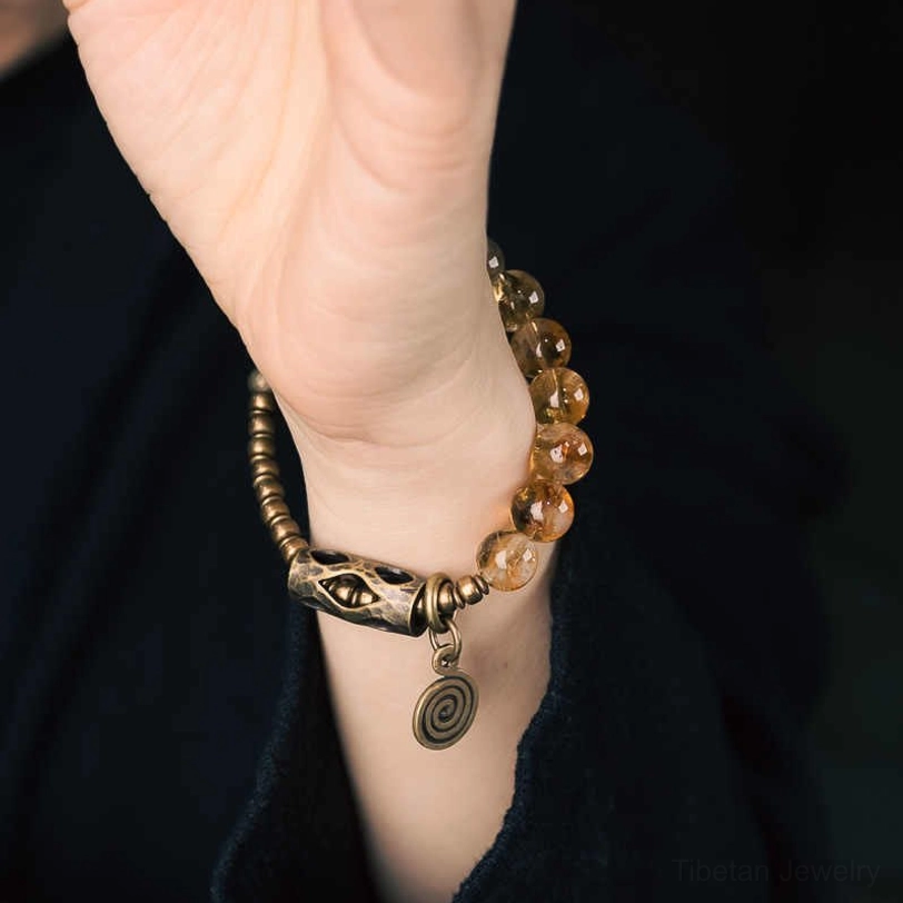 Handcrafted citrine 10mm bead bracelet artisan detail showing master craftsman quality