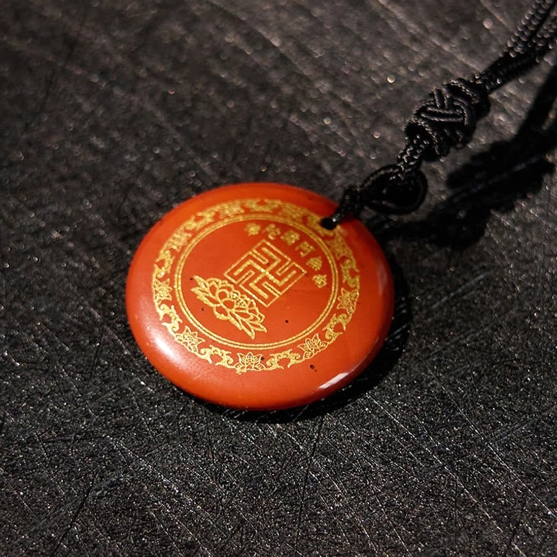 Clear crystal Buddhist necklace pendant showing transparency and light qualities