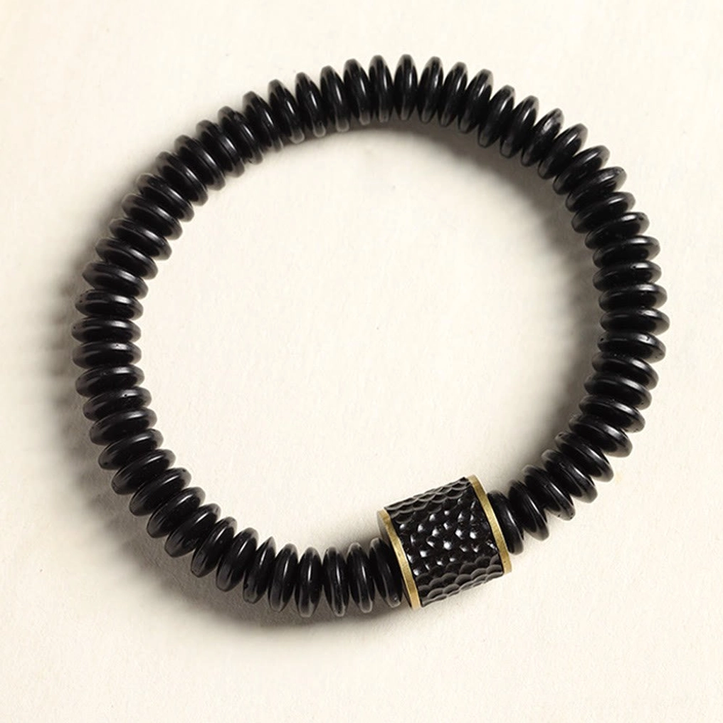 Detailed view of individual coconut shell beads showing natural texture and polished finish