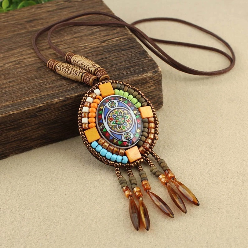 Vibrant multicolor handcrafted mandala pendant necklace with wooden accents and traditional leather tassel