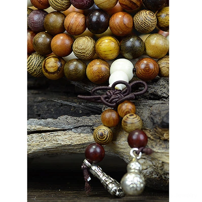 Complete 108 bead natural wood Tibetan mala necklace with warm-toned wooden beads and decorative silver pendants