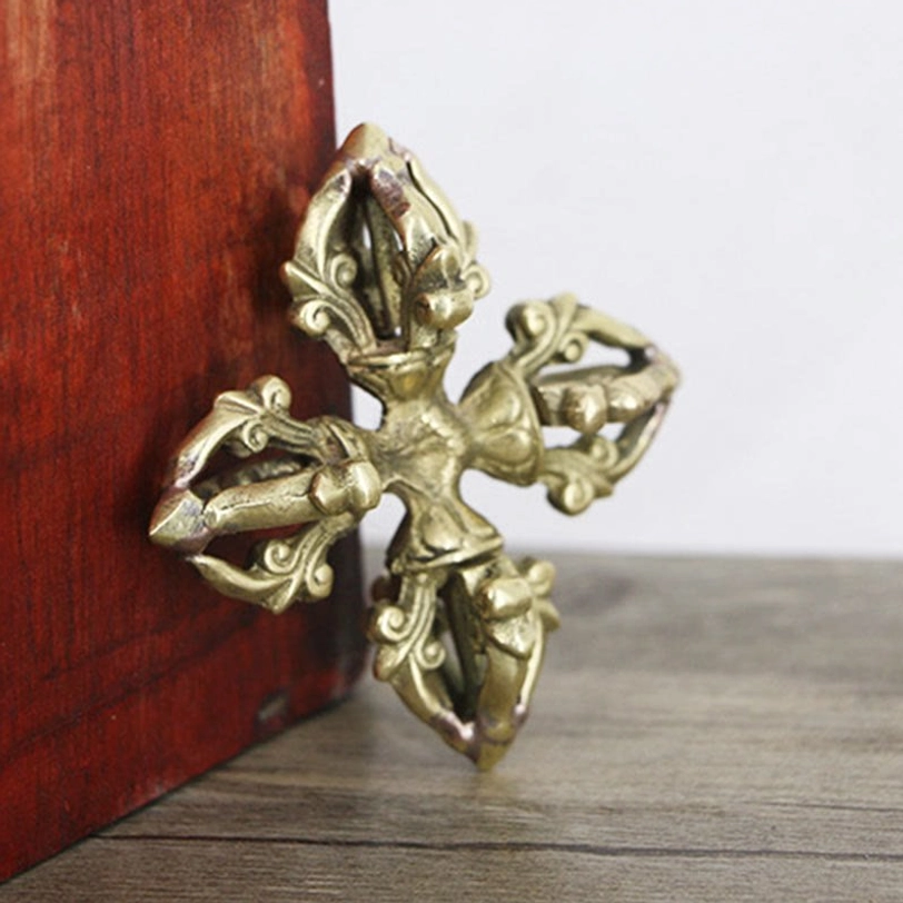 Copper 5-prong double dorje vajra side close-up showcasing three-dimensional carved details, edge patina, and authentic cross-shaped metal craft