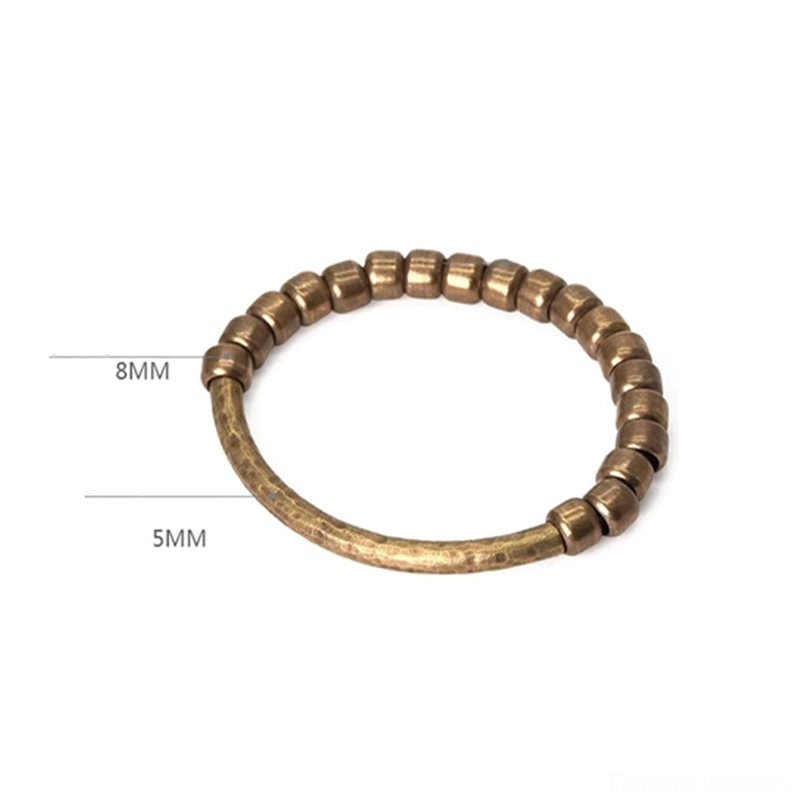 Artisan copper bracelet beads detail, highlighting premium elastic string construction and traditional Tibetan-inspired craftsmanship