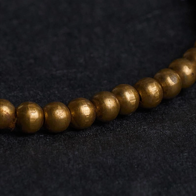 Macro close-up polished metallic copper brass beads smooth matte finish detail