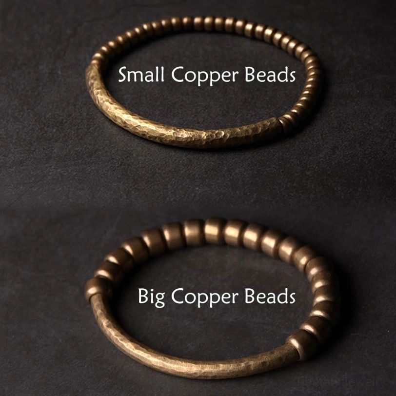 Multiple sizes of handmade copper brass beaded bracelets displayed together, showing variety in small and large bead options