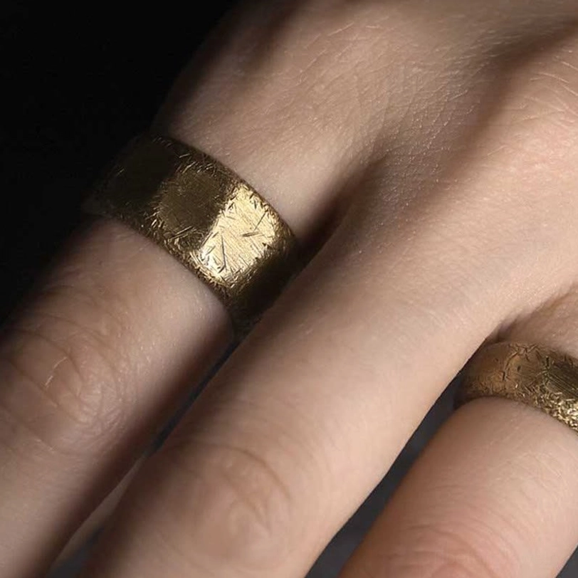 Prosperity ring in warm copper-brass blend - frosted finish reflecting spiritual energy and wealth attraction