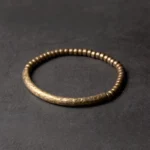 Handcrafted copper brass beaded bracelet with small 5mm beads in hammered vintage bronze finish, overhead flat lay view