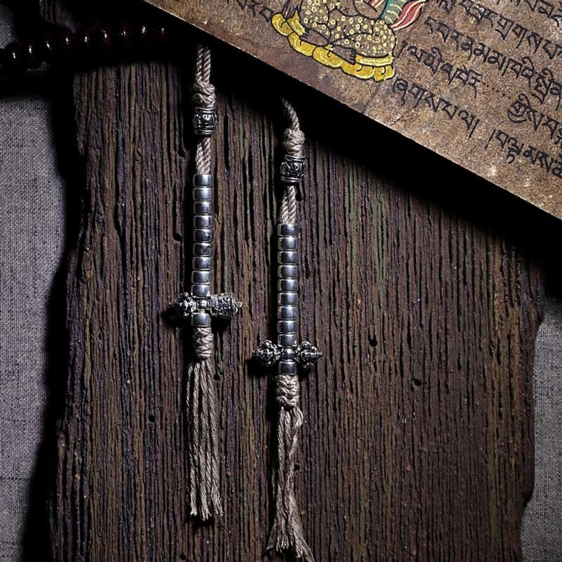 Copper dorje counters and silver accessories with traditional knots from Tibetan mala bracelet