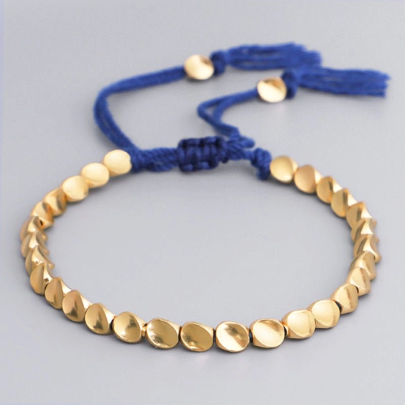 Blue rope Tibetan copper healing bracelet with matte gold beads and royal blue woven strap