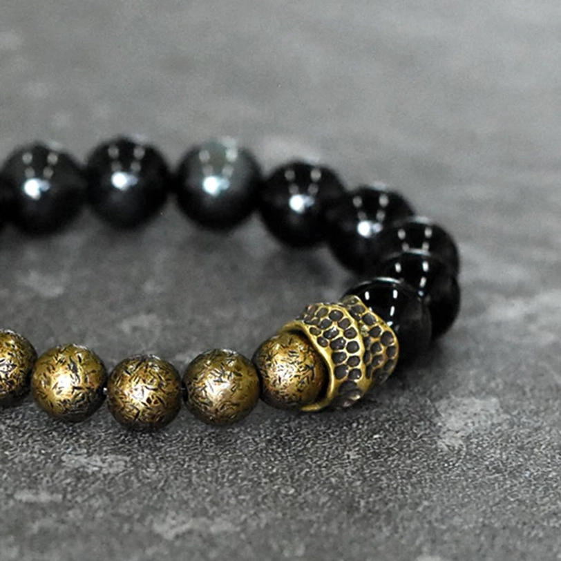 Obsidian Bronze Beaded Bracelet Close View - Carved Bronze Central Metal Ornament with Round Matte Bronze Beads and Polished Black Obsidian Beads