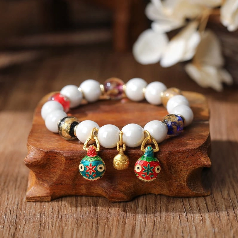Copper Gold Pixiu charm bracelet with colorful porcelain beads and mixed metal spacers featuring three enamel fish-themed pendants