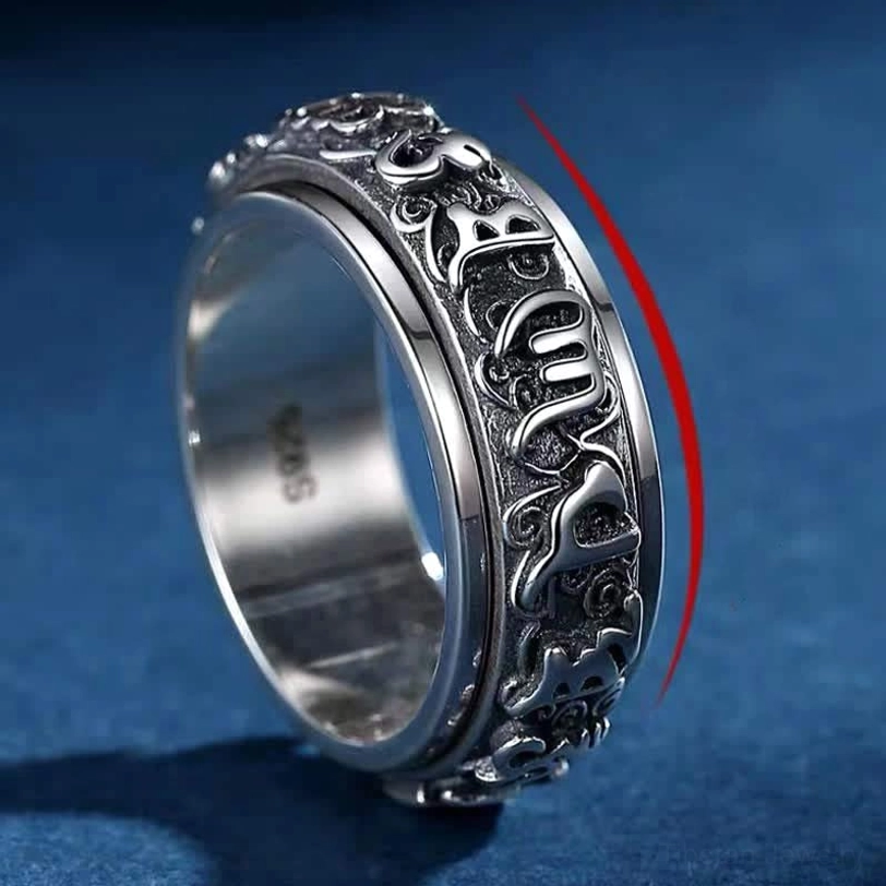 Tibetan spiritual rotatable ring side oblique view showing full-surround embossed patterns and 925 marking with double-layer structure