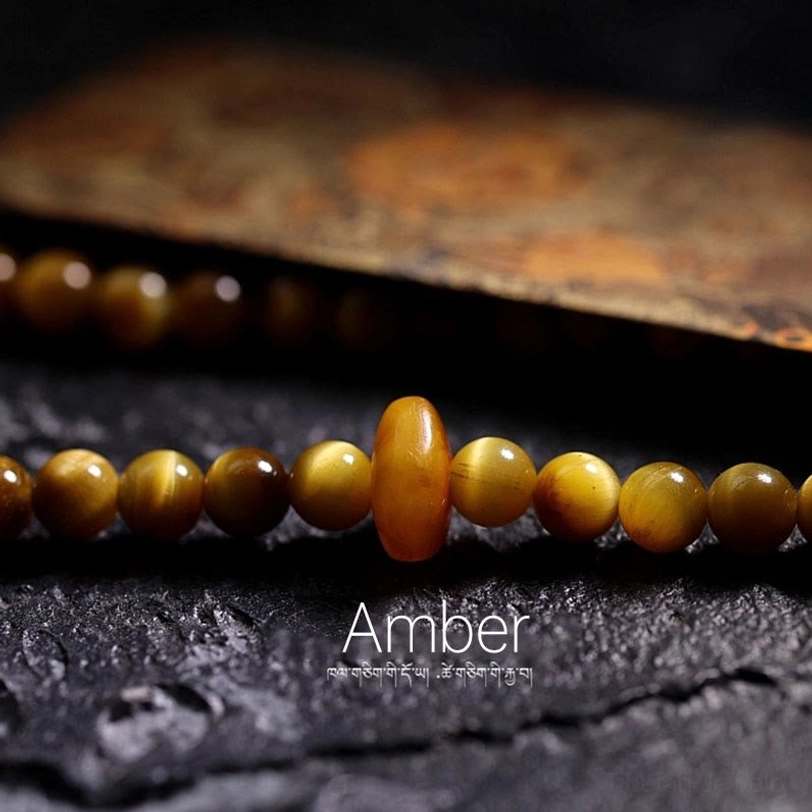 Copper Vajra dorje mala guru bead accent symbolizing enlightenment and spiritual power in Buddhist tradition