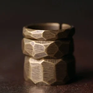 Stacked adjustable copper rings multiple widths front display bronze finish