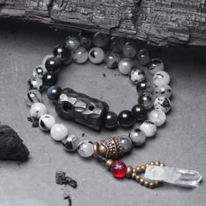 Black rutilated quartz ebony wood white crystal couple bracelet set flat lay view showing both matching bracelets