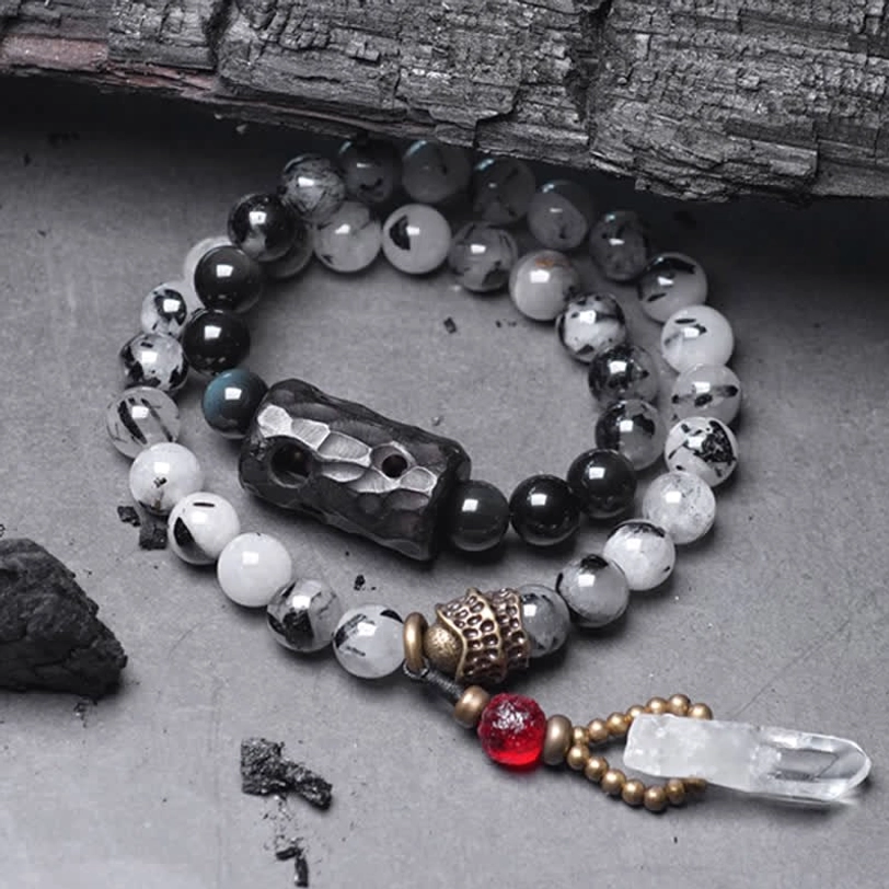 Black rutilated quartz ebony wood white crystal couple bracelet set flat lay view showing both matching bracelets