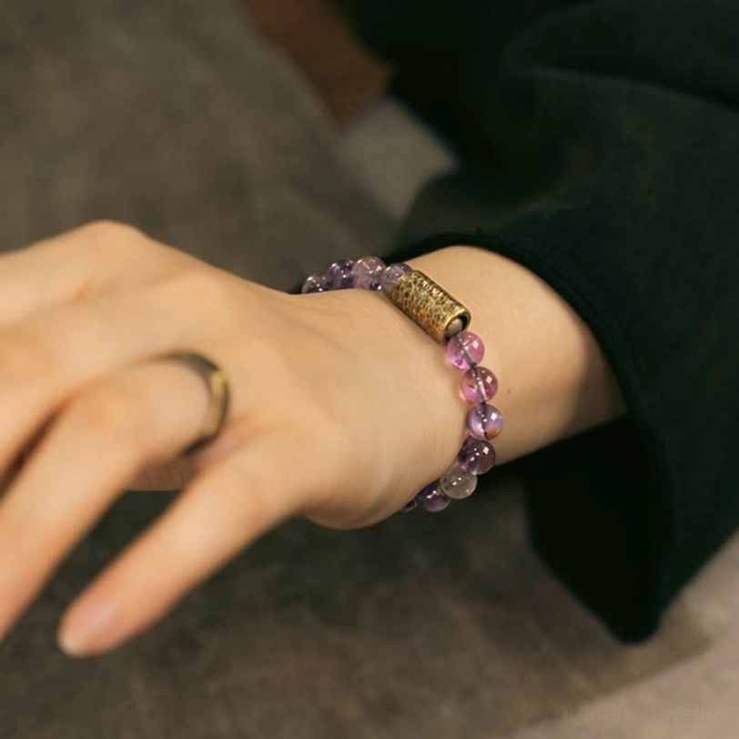 Customer wearing crystal healing bracelet in everyday setting, testimonial lifestyle photography