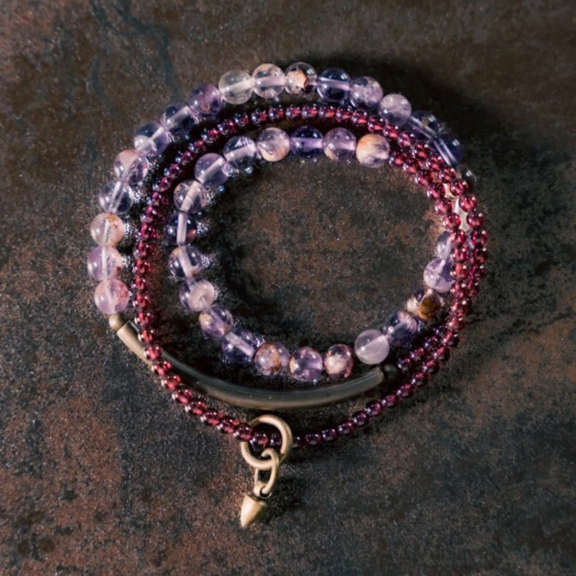 Amethyst garnet balance bracelet angled view showing 6mm and 4mm bead sizes with brass accent