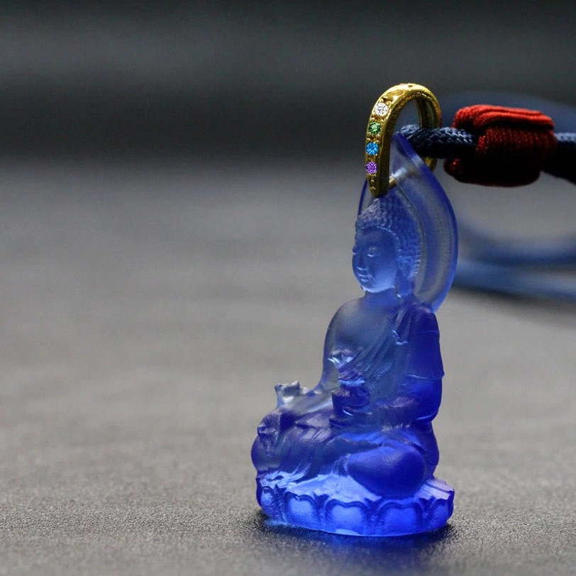 Dark blue Tathagata Buddha Liuli crystal pendant on rope necklace, deep indigo translucent crystal displaying Buddha figure and lotus base