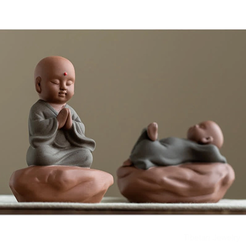 Dark clay Buddha figurine with lotus flower and wooden base spiritual meditation decoration