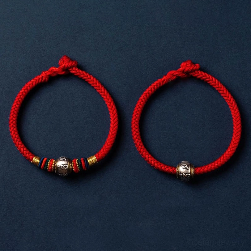 Dark red Om Mani Padme Hum Tibetan bracelet showing traditional braiding and knot work