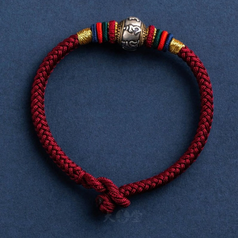 Full circle dark red Om Mani Padme Hum Tibetan bracelet with minimalist design and braided knot