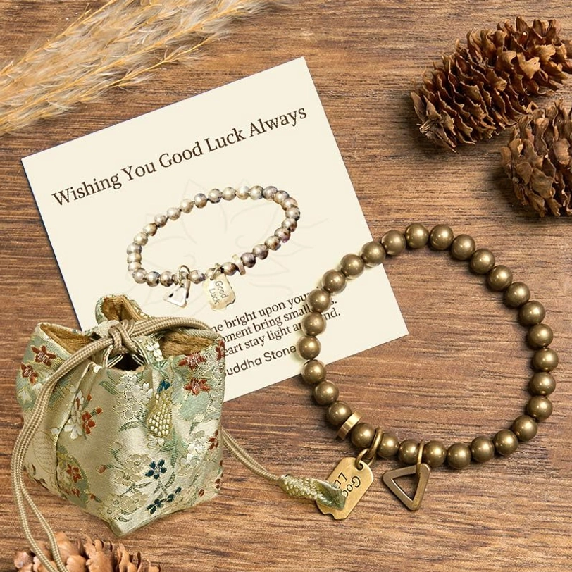 Tibetan luck charm bracelet deluxe gift set with embroidered drawstring bag and matching greeting card on wooden surface
