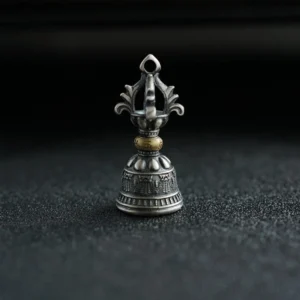 Ornate five-prong dorje bell with embossed religious motifs, frontal upright view of handcrafted silver pendant