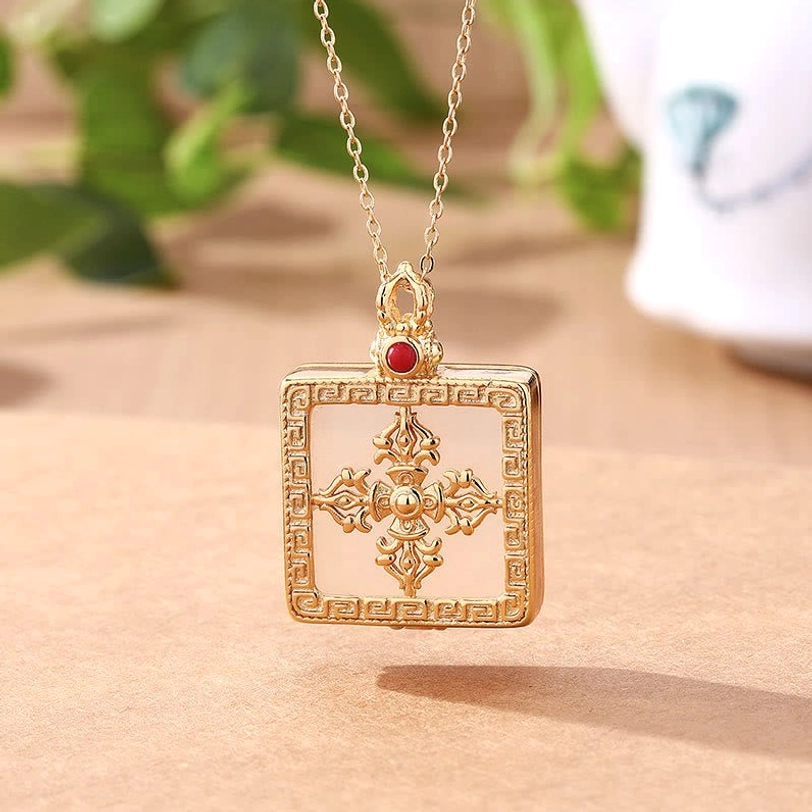 White jade double dorje gold necklace with intricate hollowed pattern red gem bail and square gold frame