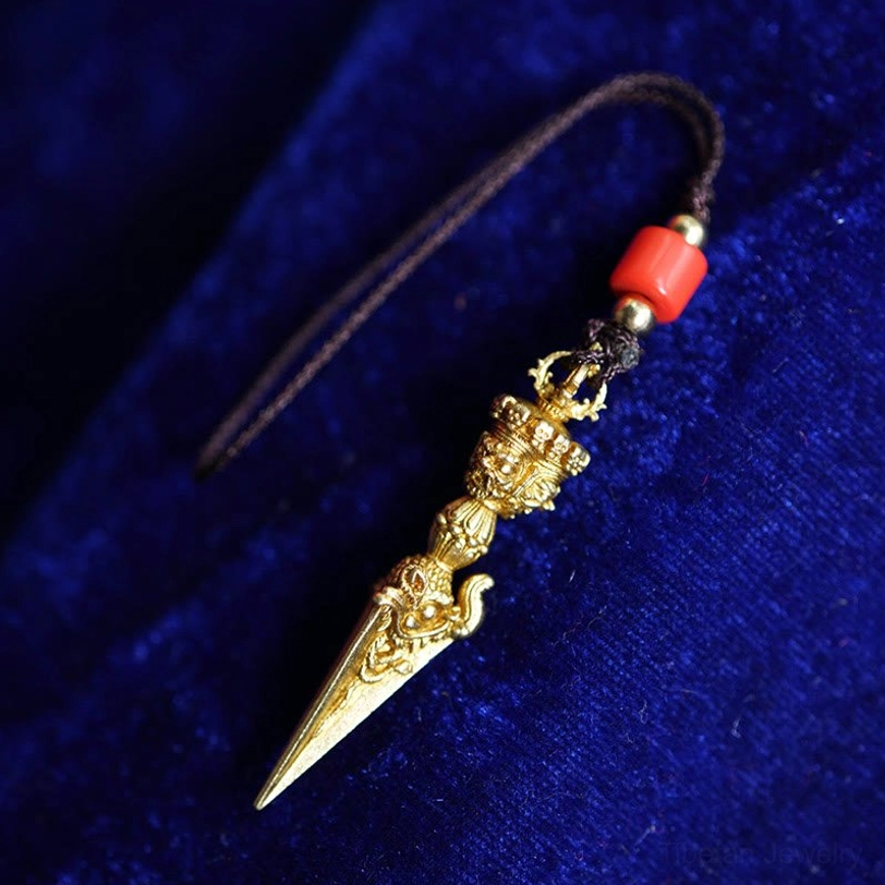 Dorje Vajra spiritual protection pendant in gold finish, frontal display view showing complete carving details and sacred Buddhist symbolism