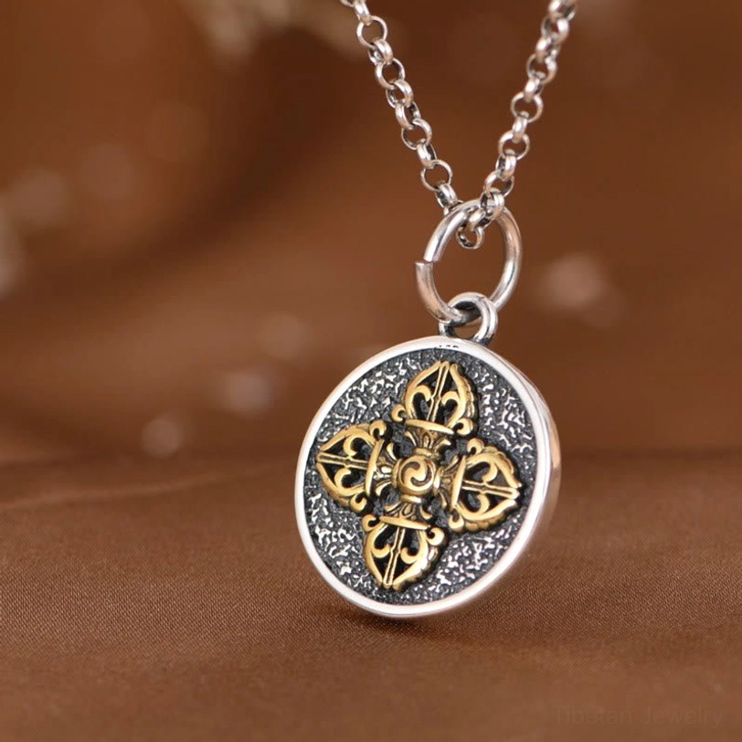 Double dorje vajra pendant side flat lay view showing back and edge detail