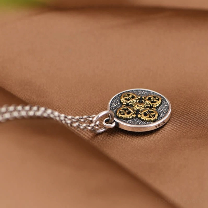 Tibetan dorje vajra necklace rear oblique view with attached sterling silver chain
