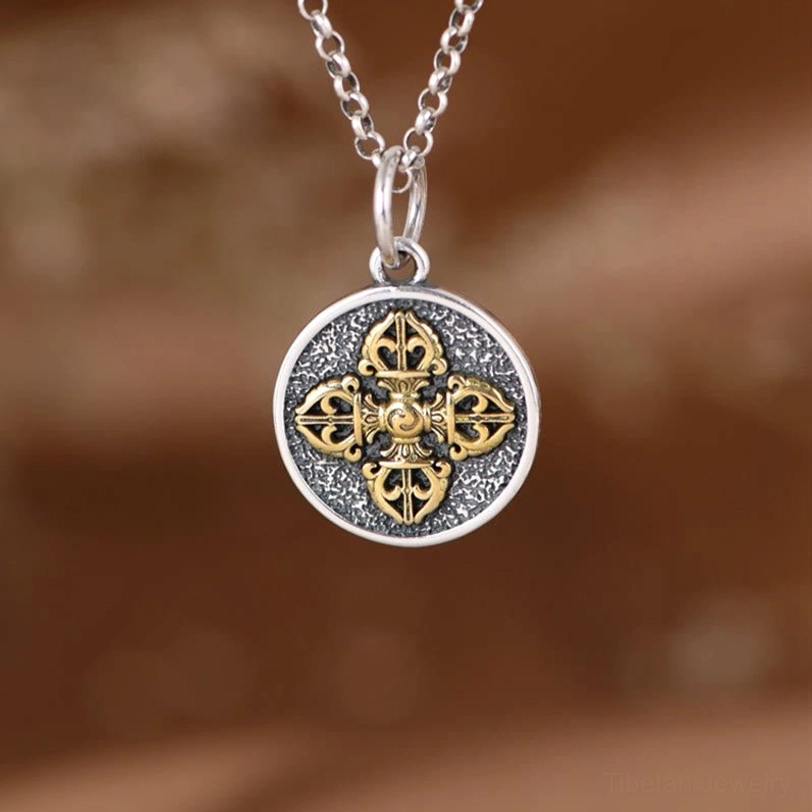 Sterling silver double dorje vajra pendant close-up frontal view showing intricate design
