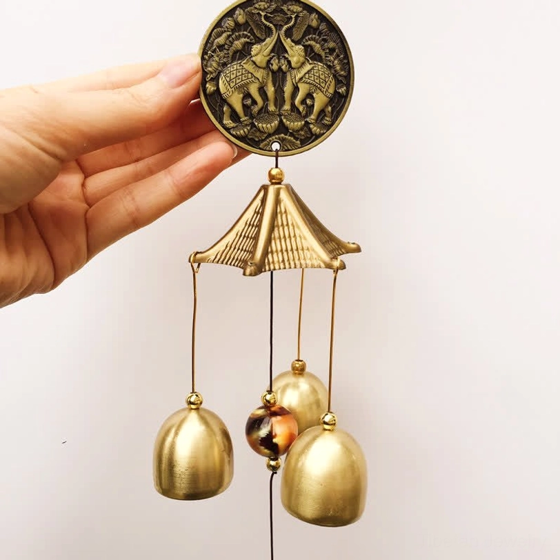 Double elephant carved bronze wind chime with three brass bells hand-held view