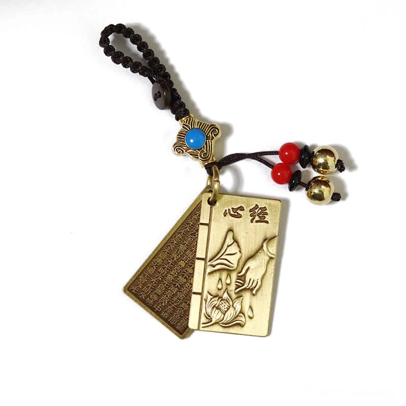 Double-page Heart Sutra brass keychain featuring dual-sided engraved Buddhist wisdom text with decorative beads