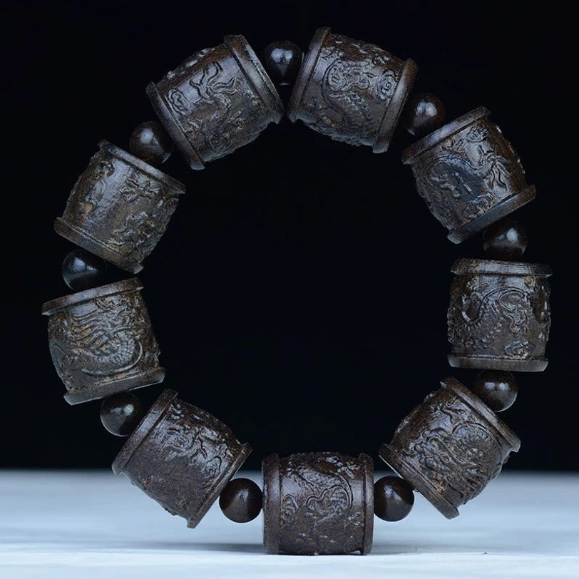 Dragon engraved ebony wood bracelet with mythical dragon protection beads and premium elastic cord