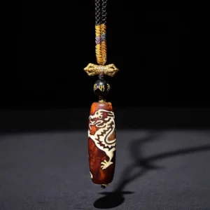 Dragon pattern nine-eye dzi agate pendant with golden knot and black script bead on adjustable braided rope