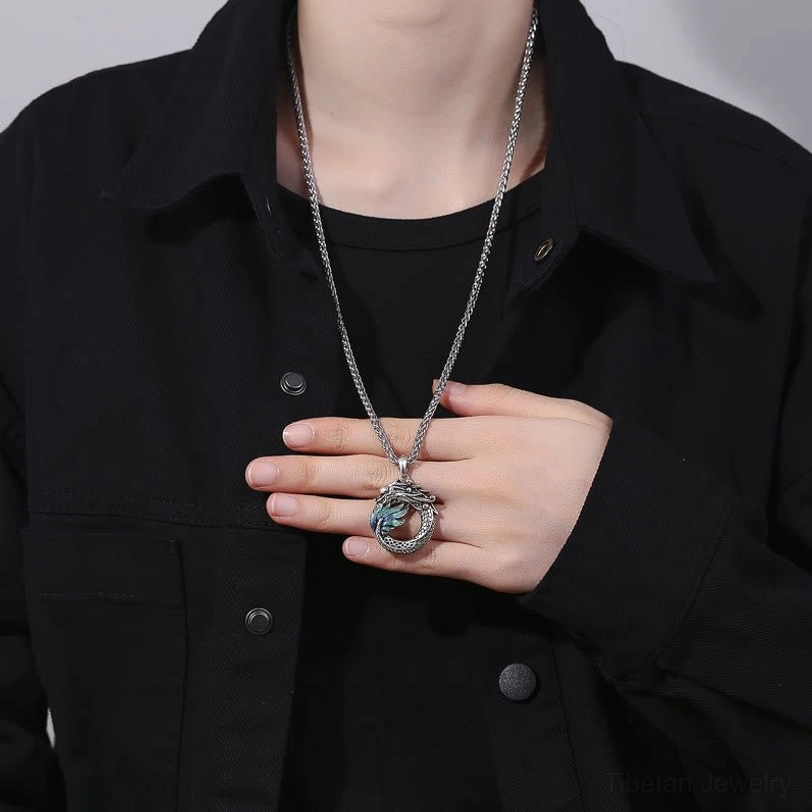 How to wear Tibetan dragon necklace - styled on person with black shirt showing pendant detail