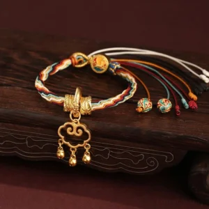 Dunhuang color braided lucky bracelet with cloud lock pendant and enamel charm beads on carved wooden board