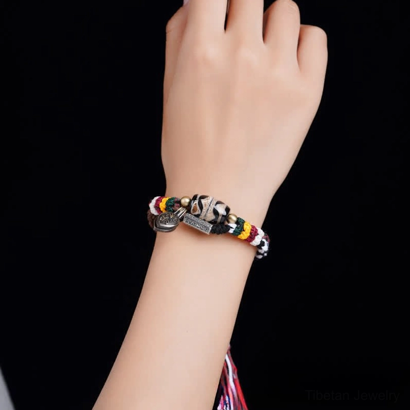 Handcrafted Tibetan Dzi bead Om Mani Padme Hum bracelet showcasing master artisan craftsmanship and natural material quality