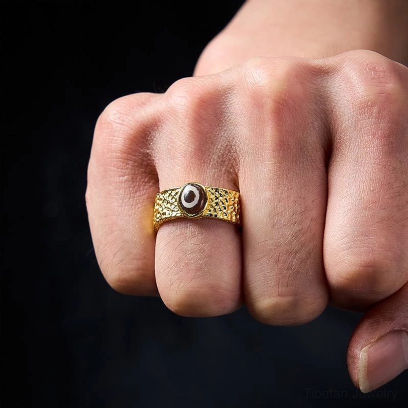 Dzi bead copper ring worn on hand demonstrating fit and how to wear adjustable sizing