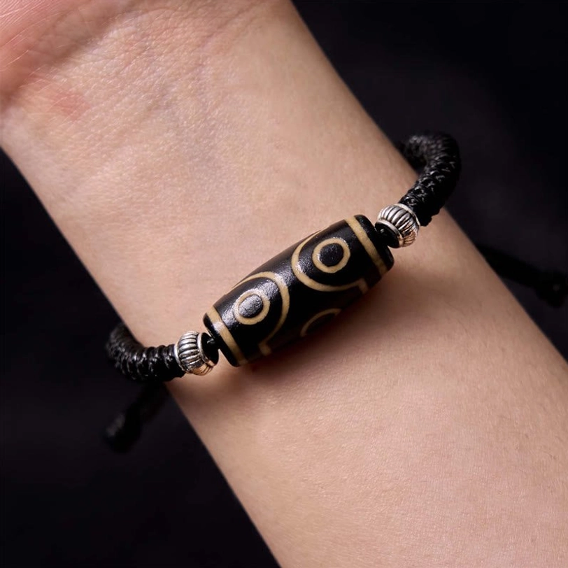 Tibetan dzi bead bracelet unboxing experience showing authentic hand-painted beads and premium elastic cord