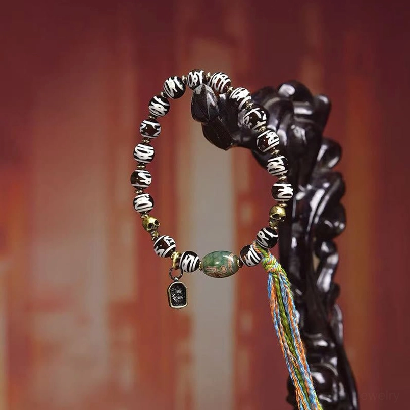 Tibetan sacred Dzi bead skull protection bracelet complete product shot with spiritual authenticity