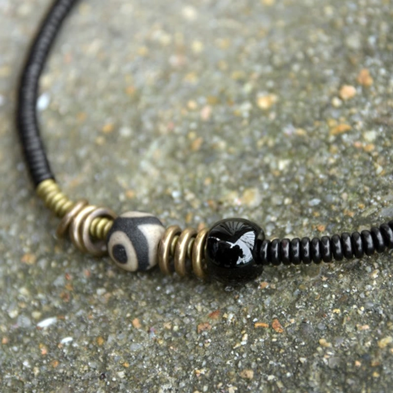 Dzi bead Tibetan protective amulet bracelet with ebony sandalwood and onyx combination