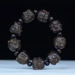 Ebony wood eighteen arhats carved wooden bracelet with hand-engraved arhat beads and spacer beads in dark brown finish