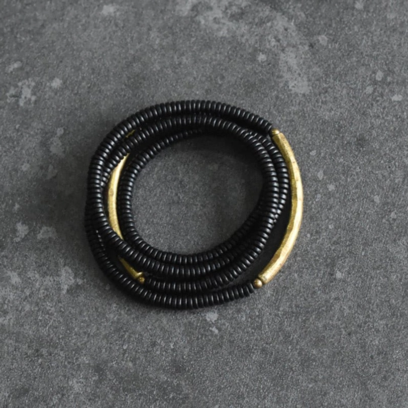 Compact ebony wood brass beaded bracelet overhead side view minimalist design
