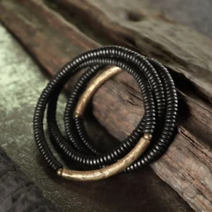 Handmade ebony wood brass beaded bracelet three-quarter view weathered wood styling