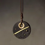 Handcrafted ebony wood and brass Tibetan peace pendant necklace with hammered texture front view